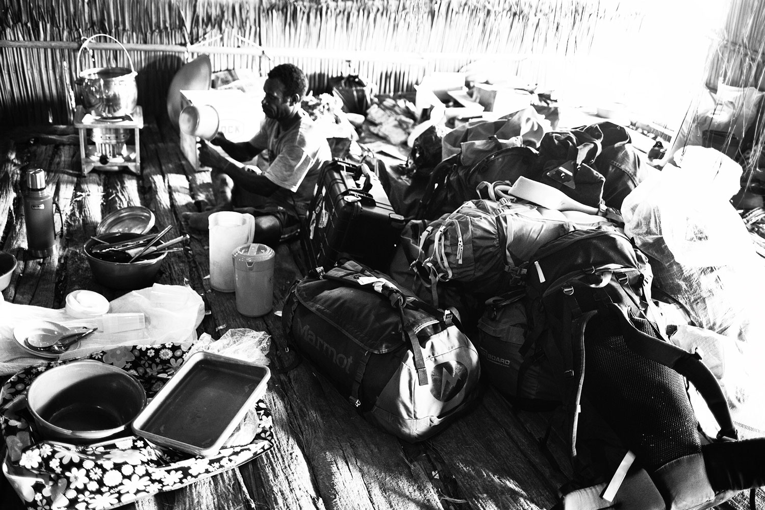 asmat camp with travel luggage